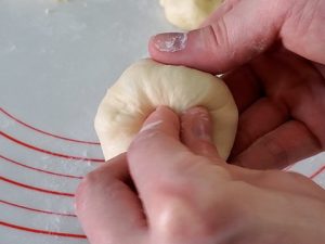 Pinching ends of dough
