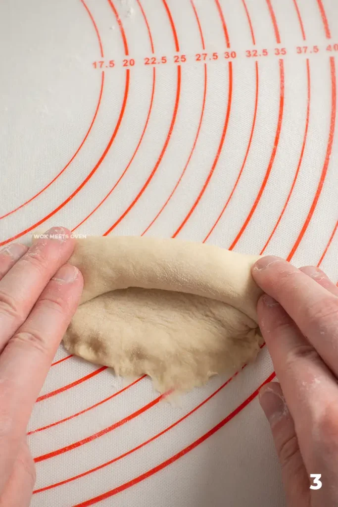 rolling dough ball to one side
