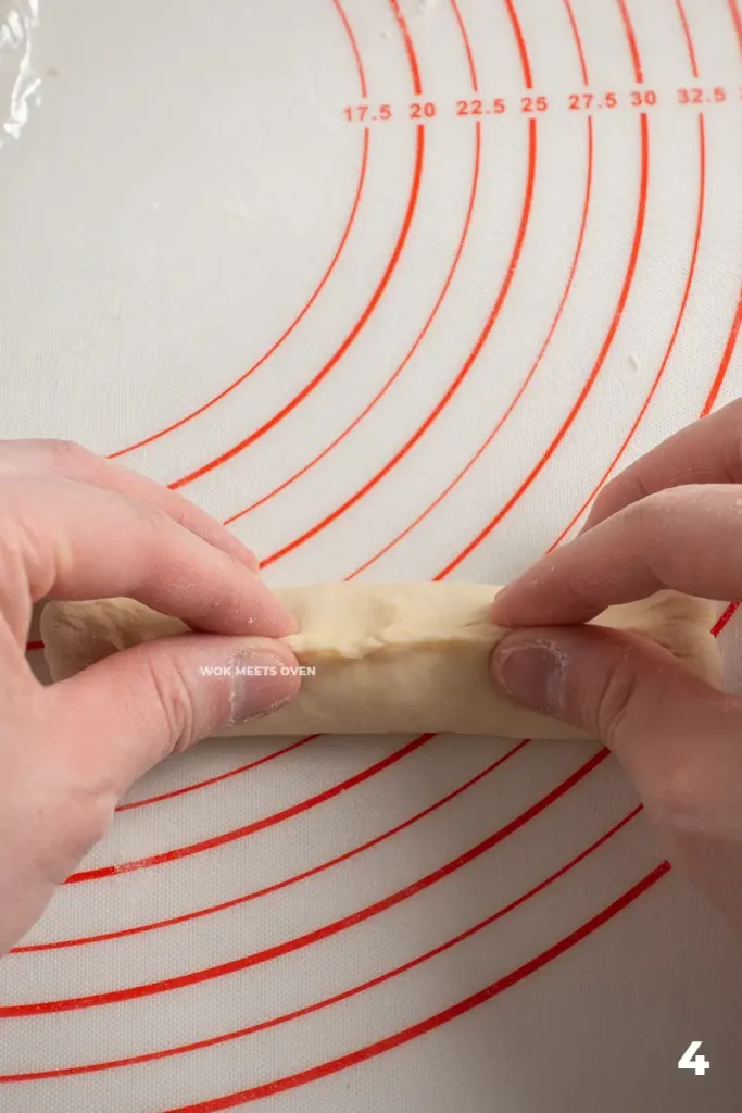 Pinching edges to seal the dough strip
