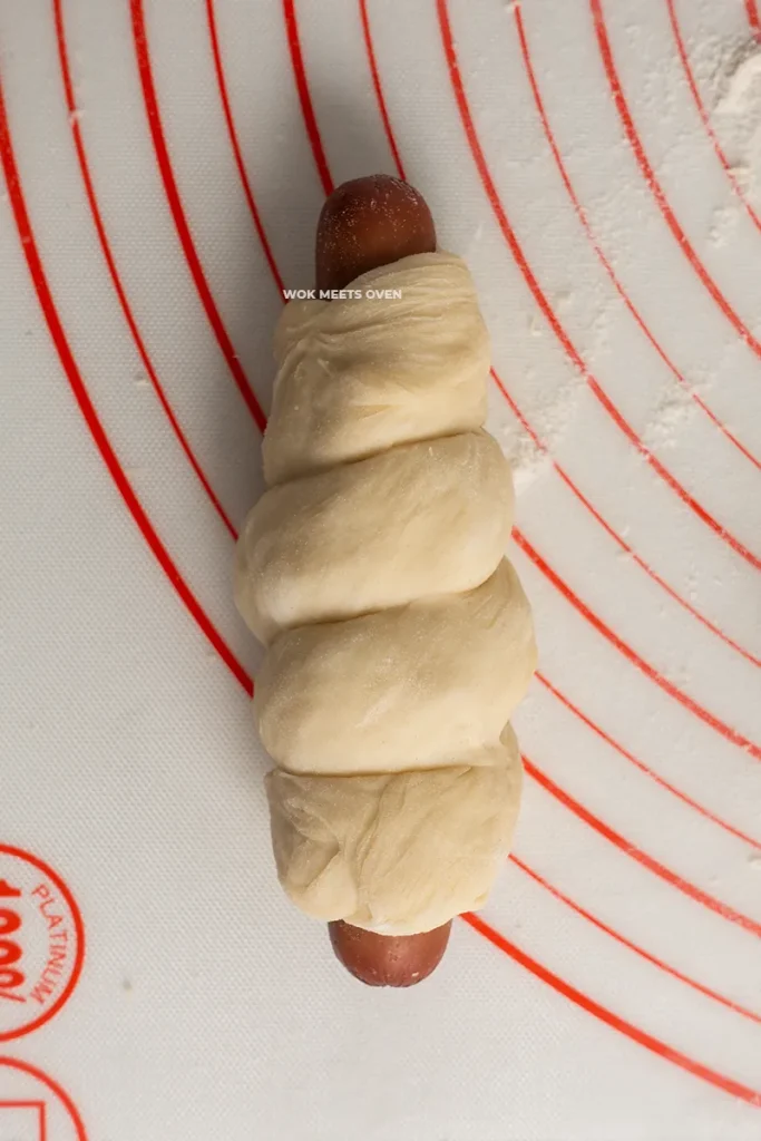 Finished wrapping dough onto hotdog