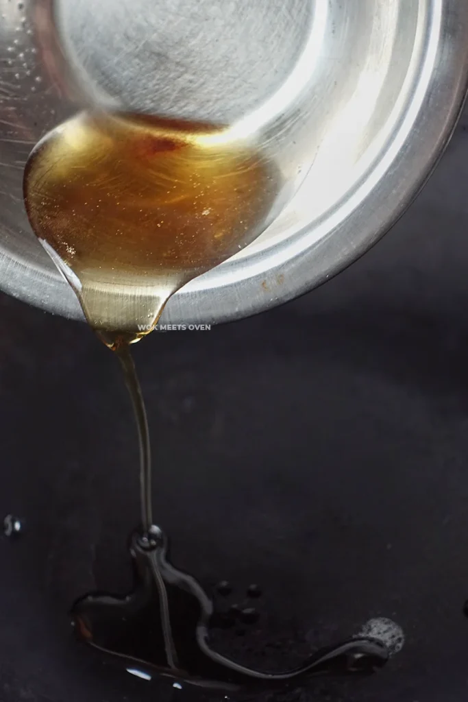 Adding in bacon oil to wok