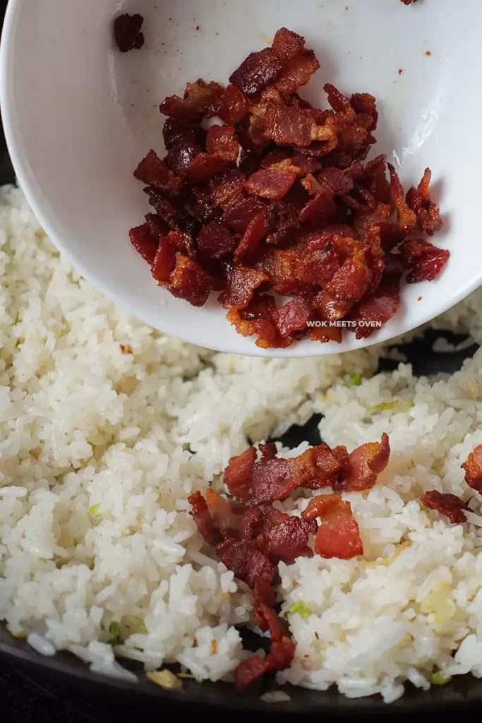 Adding in bacon to fried rice