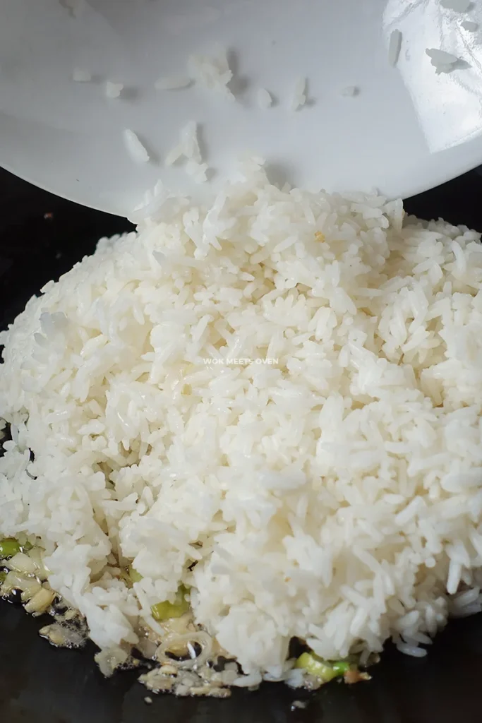 Adding in leftover rice to wok