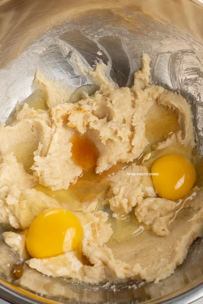 Adding in eggs and vanilla extract