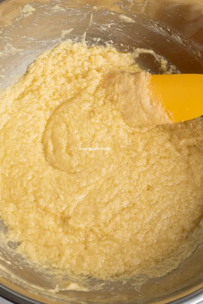 Mixing eggs, vanilla extract, sugar, and butter