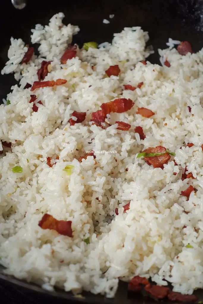 mixing bacon with fried rice