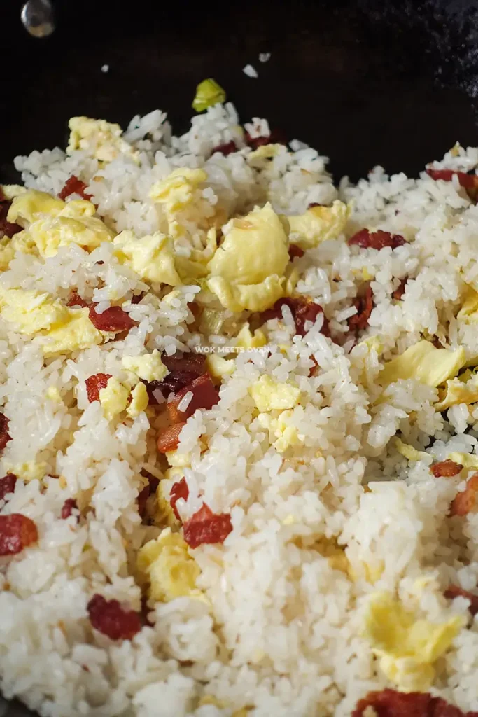 Mixing eggs with fried rice