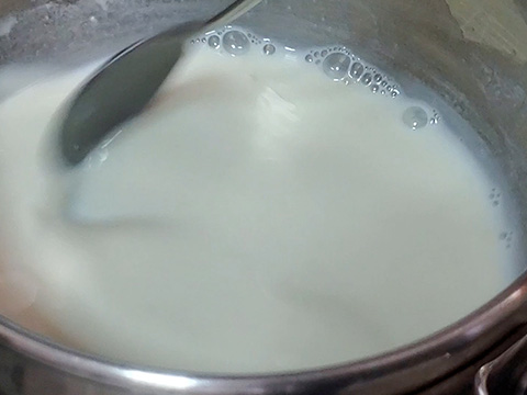 Stirring flour and water inside of pot