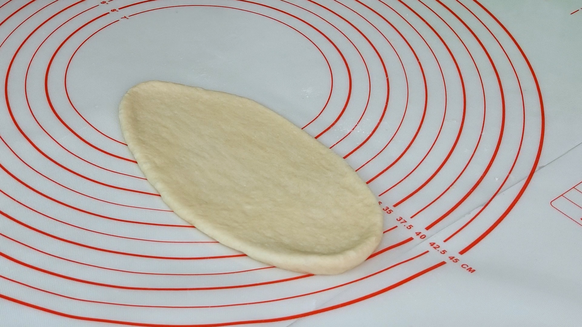 Dough flattened and rolled out