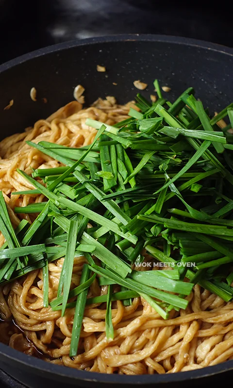 Adding in chives to wok