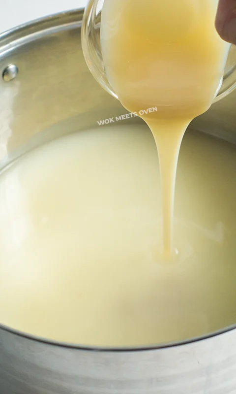 Adding in condensed milk into pot