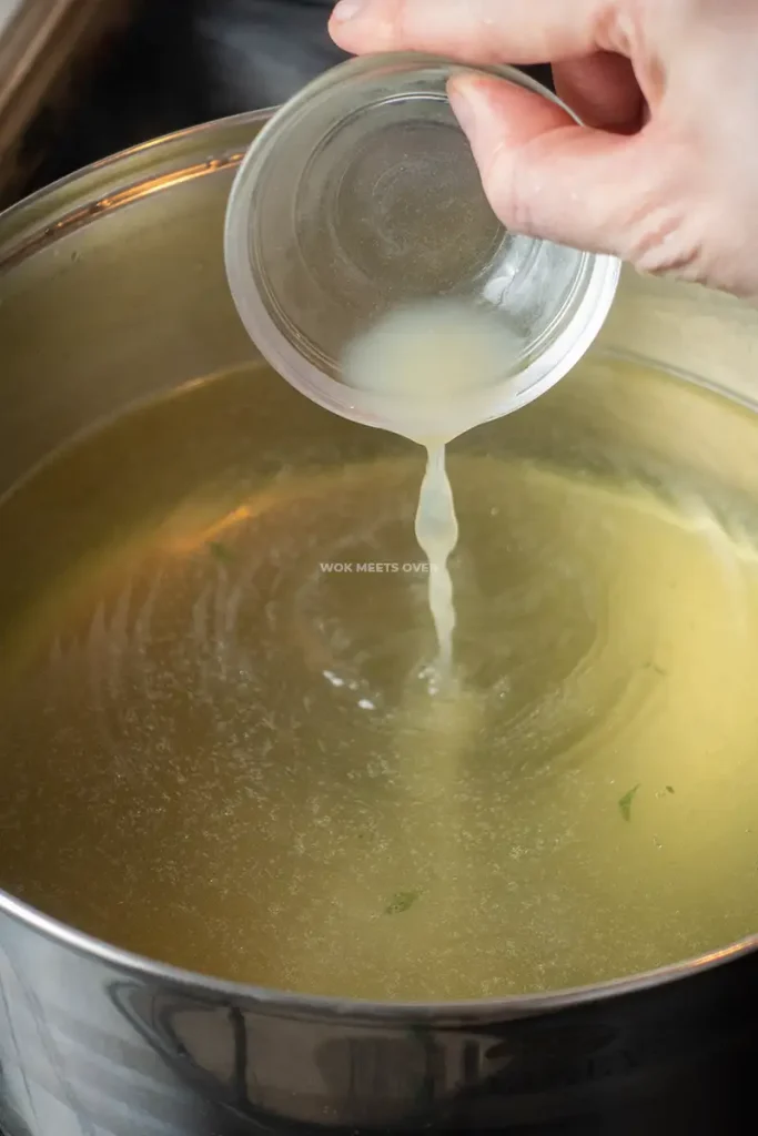 Adding in lime to water spinach broth