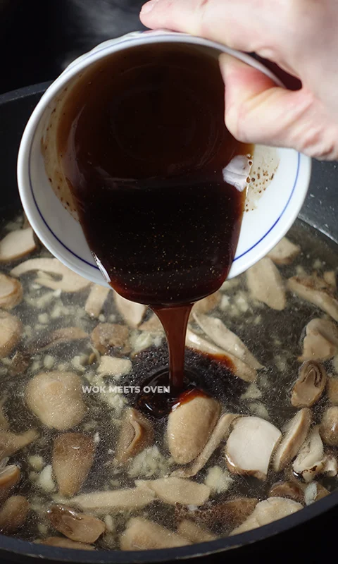 Adding in sauce to wok