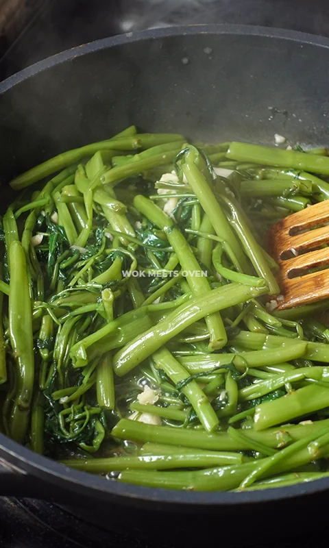 Ready to serve water spinach in wok