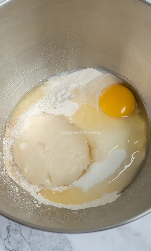 Dough ingredients inside of mixing bowl