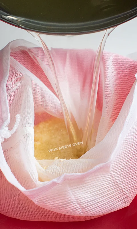 adding in boiled water into cheese cloth bag