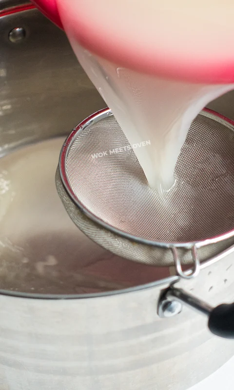 Pouring out liquid into large pot