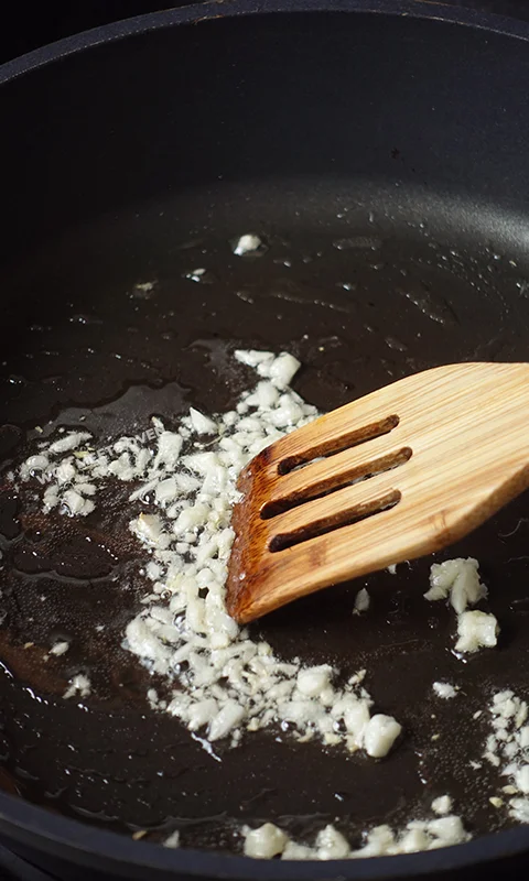 Added in garlic to wok