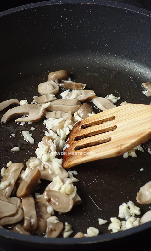 adding in garlic to wok