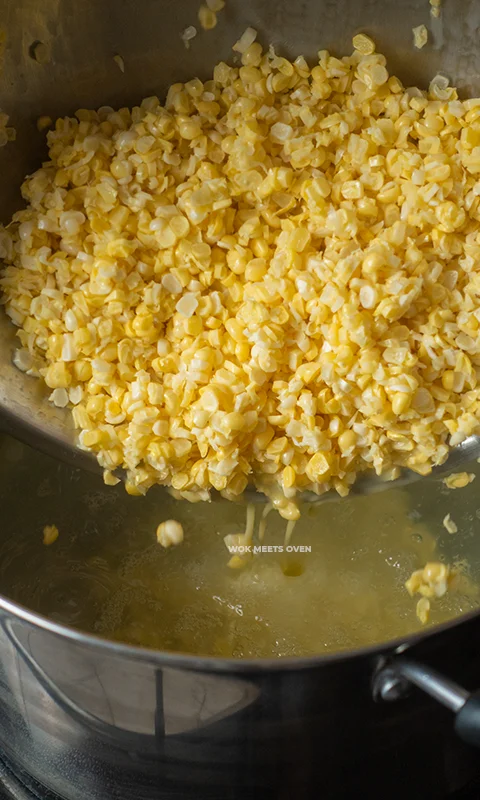 Adding in corn kernels into pot
