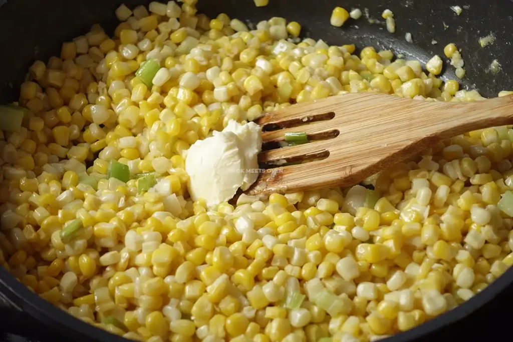 Adding in margarine to corn kernels