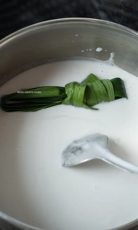 Adding in Pandan leaves into pot