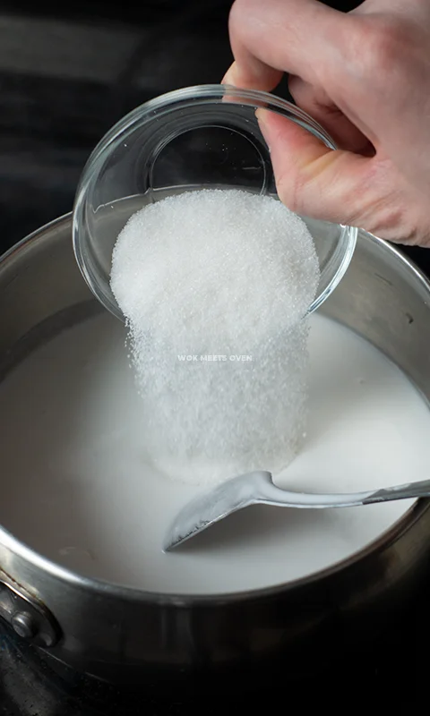 Adding in sugar into pot