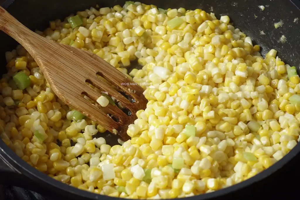 Stir-frying corn with sugar and water