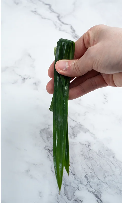 Folding Pandan leaves into 3 sections second section