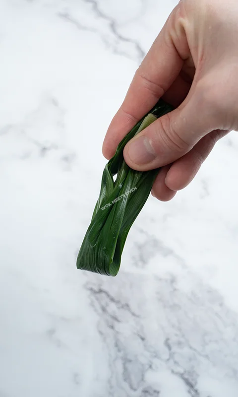 Folding Pandan leaves into 3 sections third section