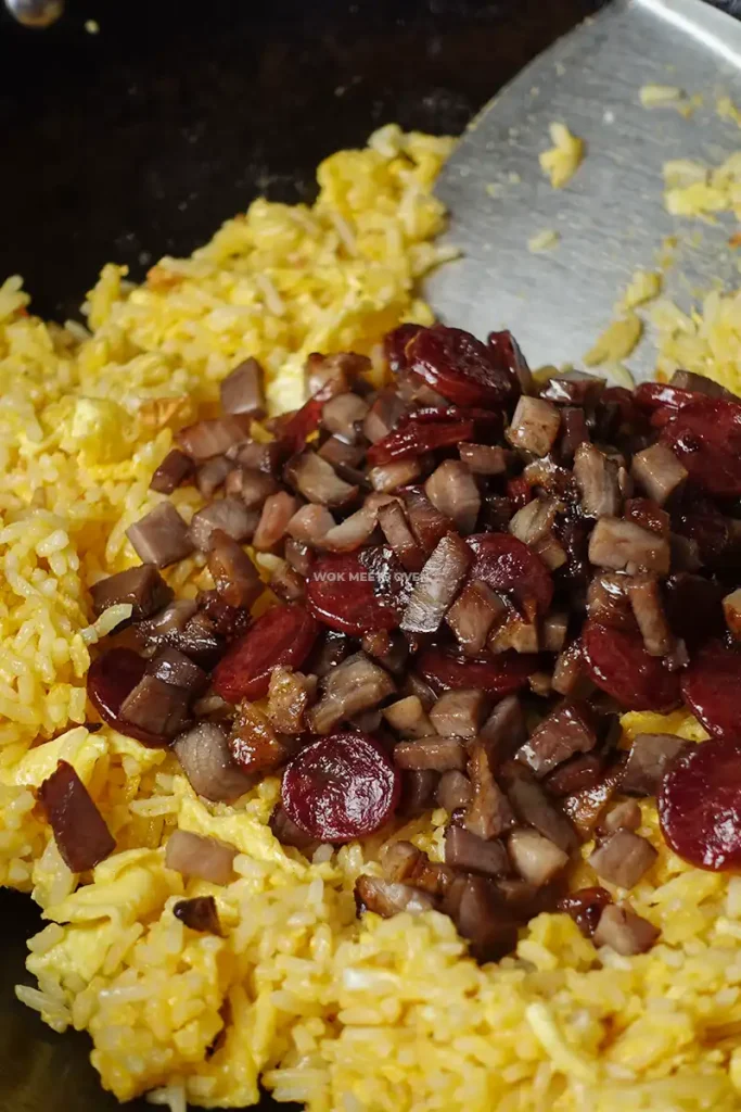 Adding in char siu and Chinese sausage to fried rice