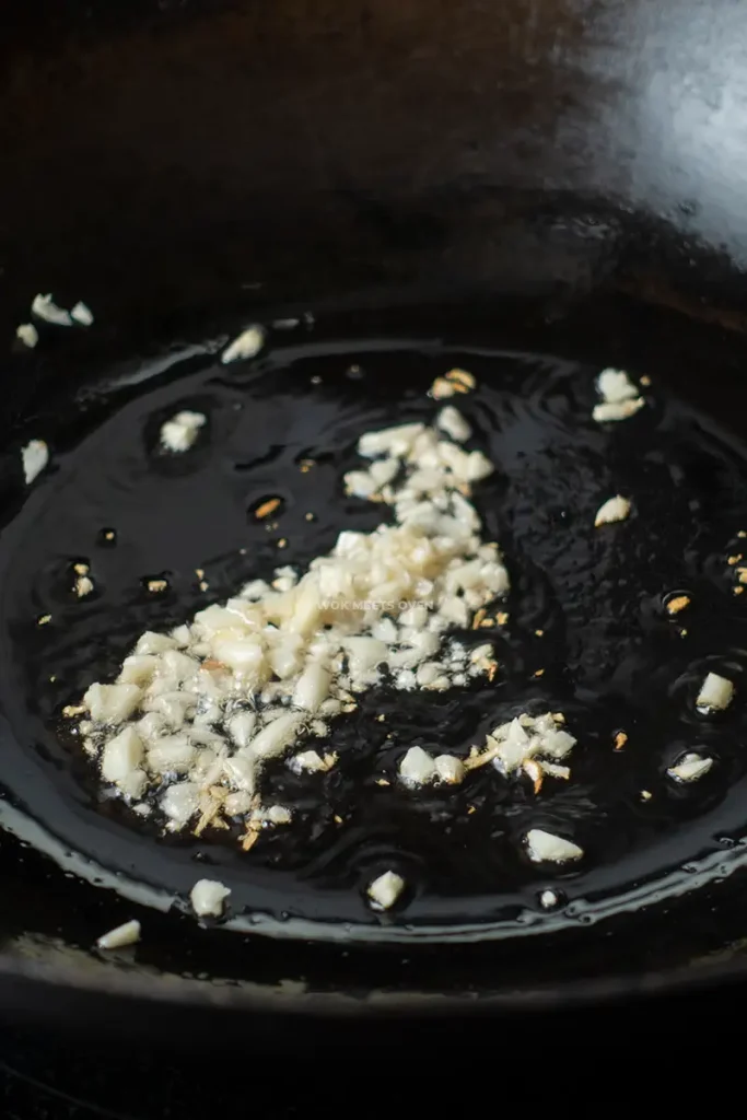 Frying garlic in wok