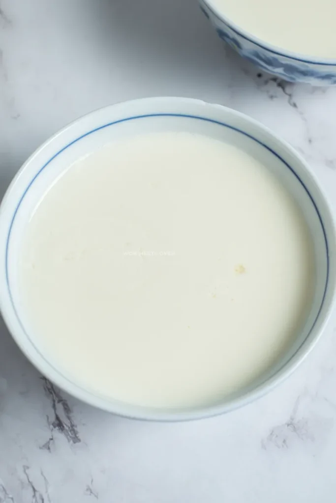 Shot of ginger milk pudding in small bowl