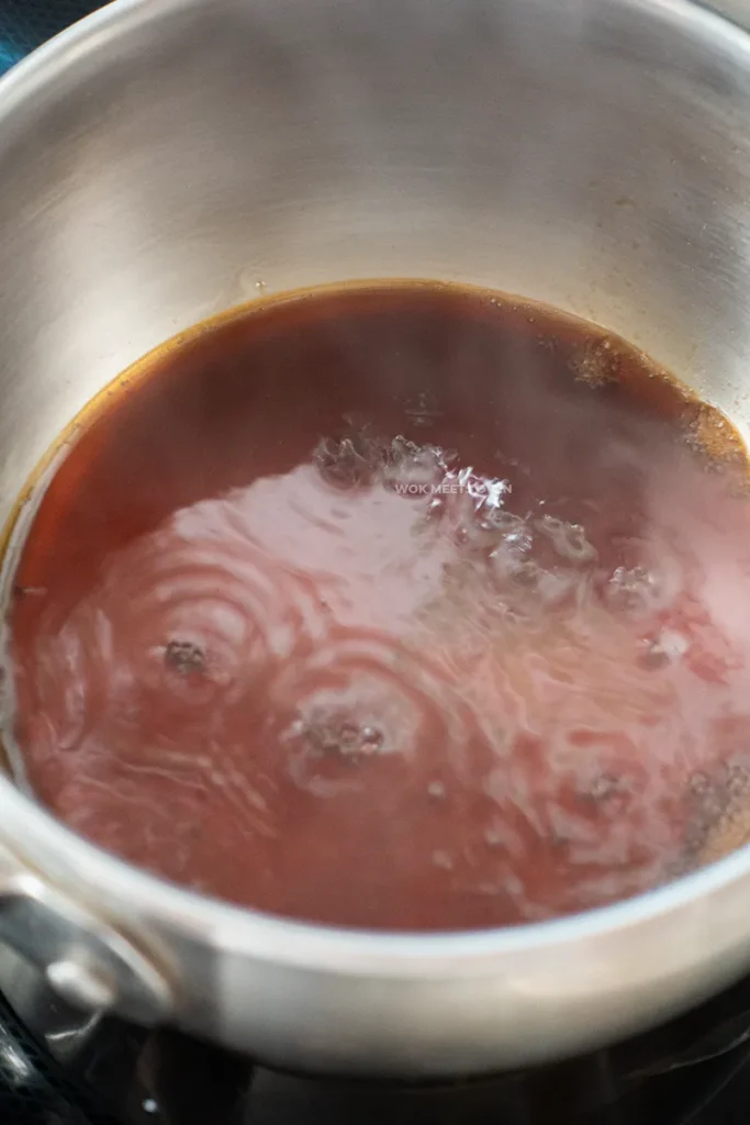 Soy sauce being heated over stove