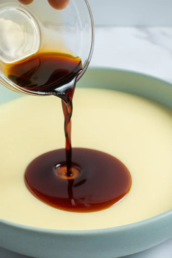 Pouring soy sauce on top of eggs