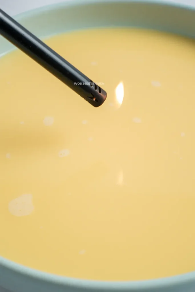 Using a lighter to pop bubbles