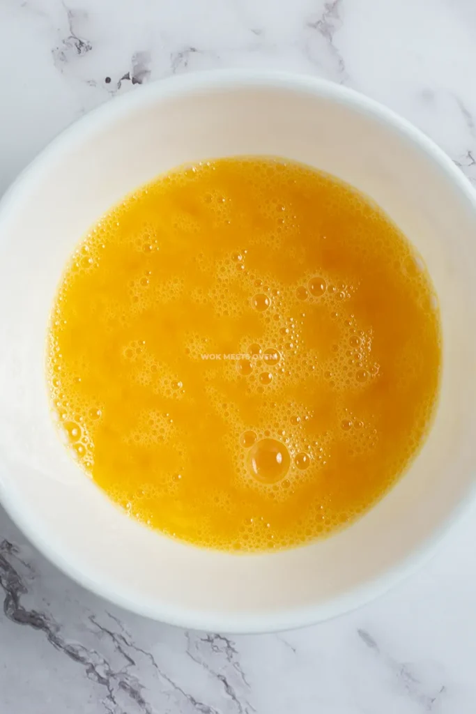 Whisked eggs in bowl