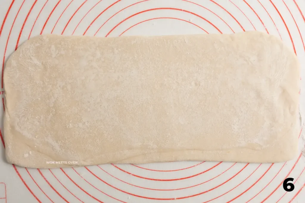 Rolling out dough again into long rectangle