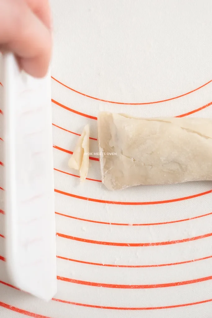 Cutting out uneven edges with dough cutter