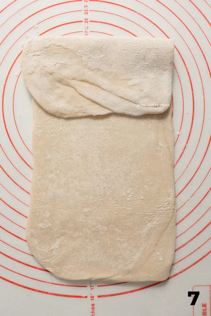 Folding right side into center of dough