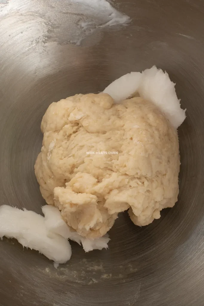 Adding in lard to water dough