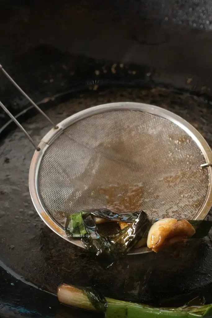 Scooping out green onions and garlic