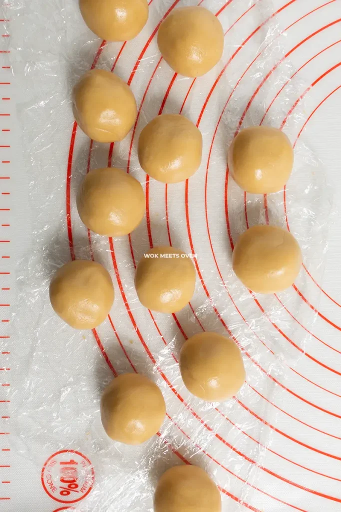 Dough rolled out into 12 balls