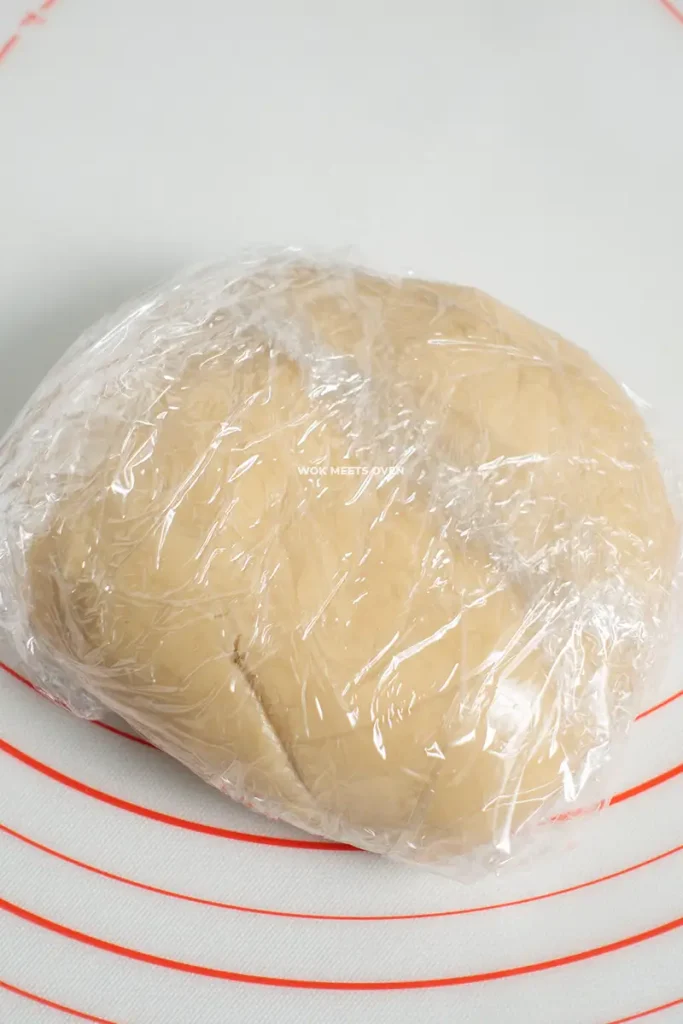 Dough wrapped in plastic wrap