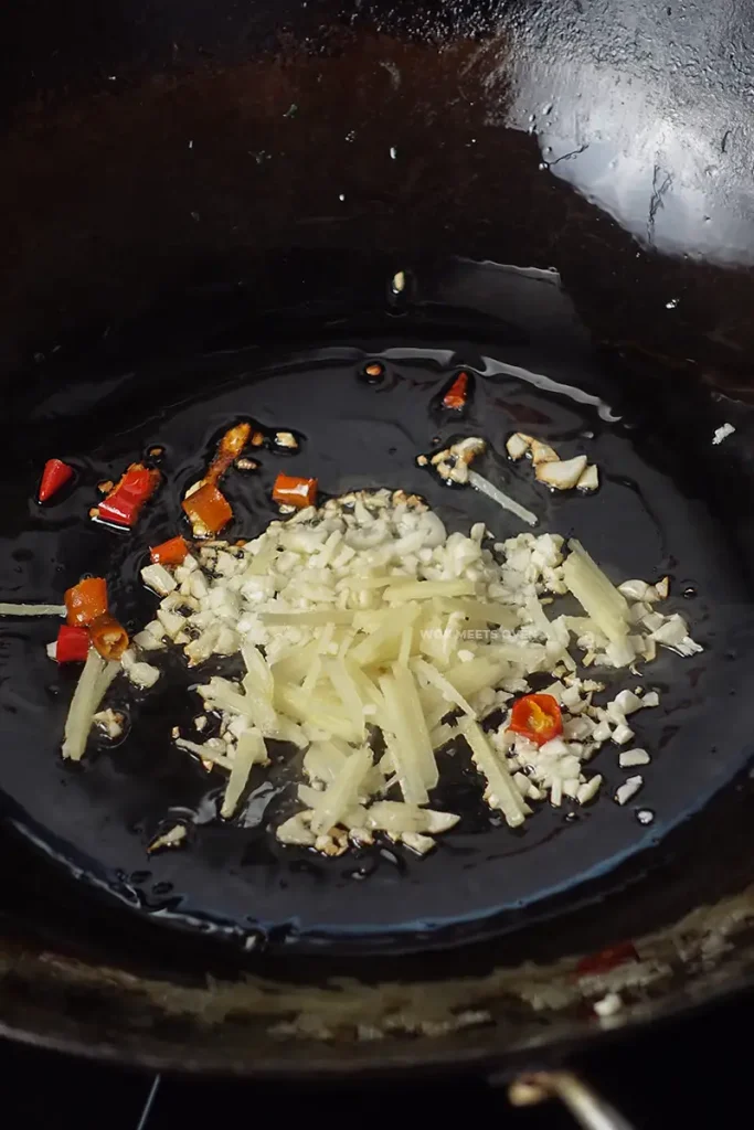 Adding in aromatics to wok