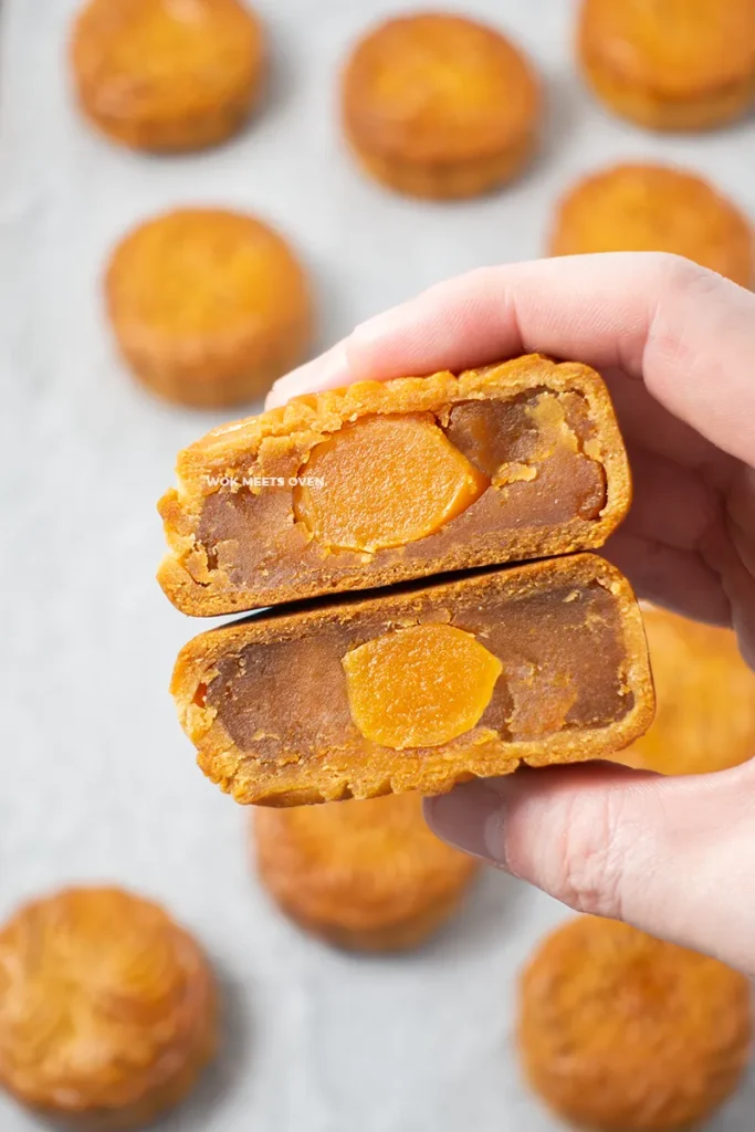 Blog image of hand holding cut mooncakes