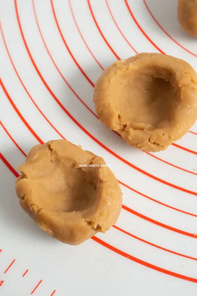 Making a hole in the lotus paste filling