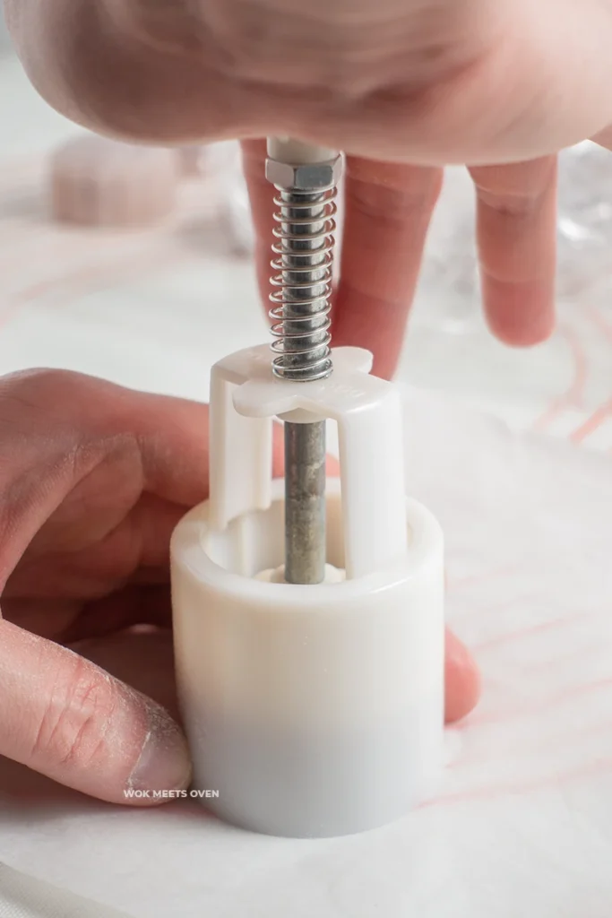 Pressing down onto moon cake mold