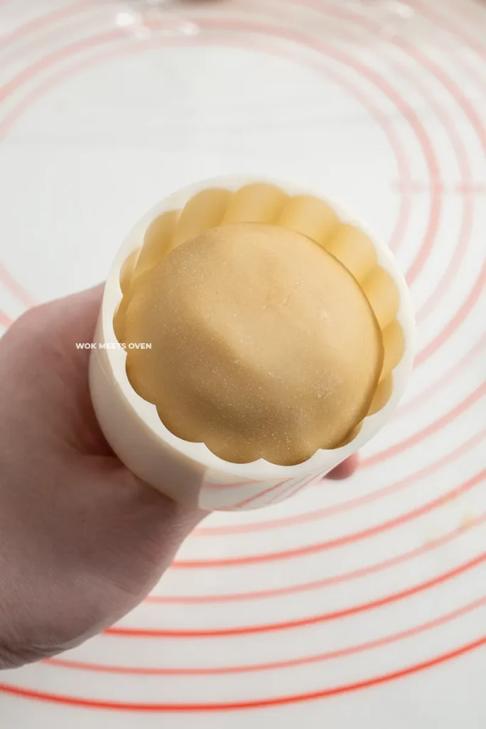 Adding mooncake balls to mooncake mold