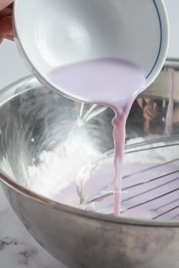 Adding in purple liquid and milk into snow skin ingredients